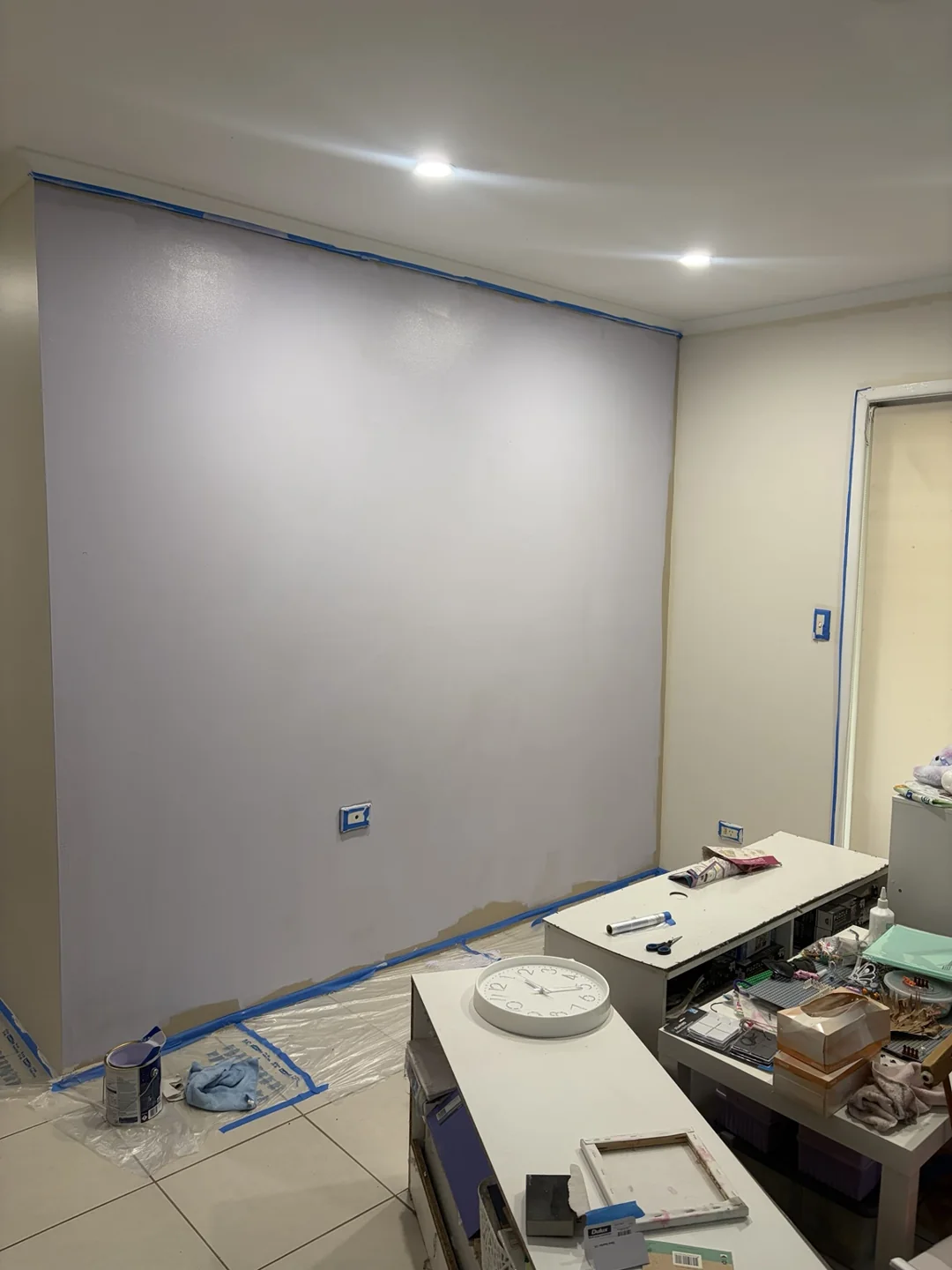 Interior wall painting with downlights and painting equipment